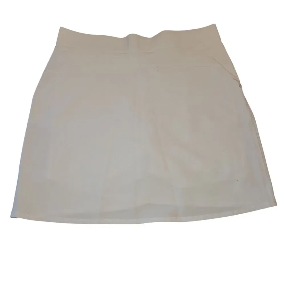 Greg Norman White Golf Skort Tennis Athletic Sz S UPF 30+ Stretch Pockets Preppy